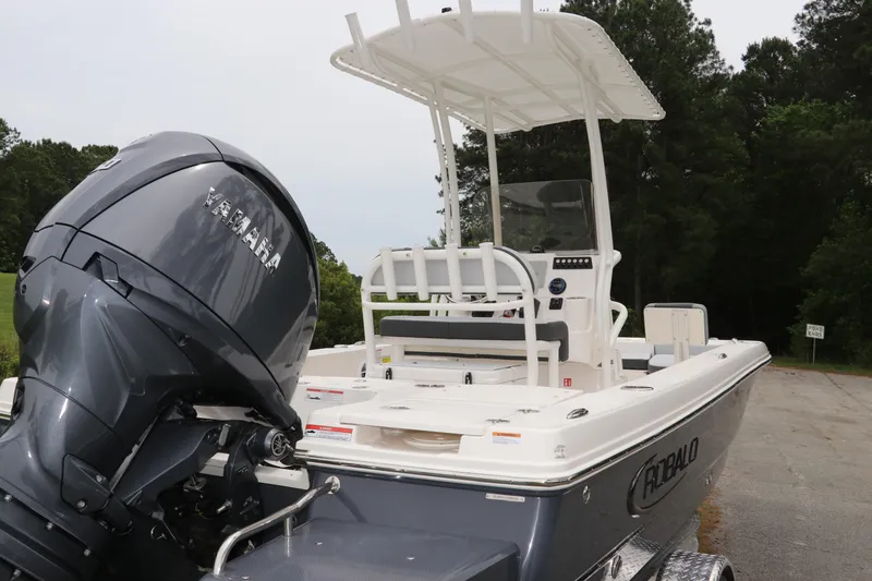 Slide: The Image of 2026 Robalo 206 Cayman boat with Yamaha engine, parked outdoors. - 7