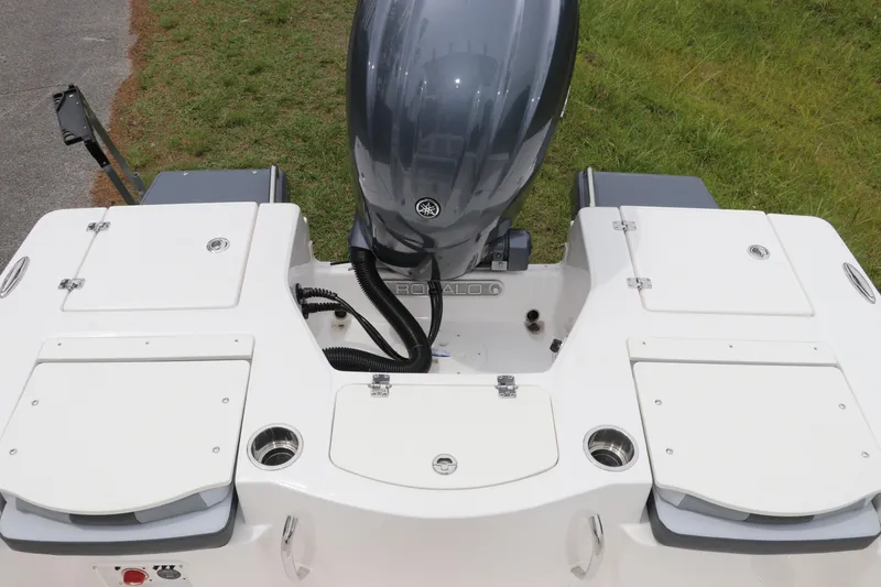 Slide: The Image of 2026 Robalo 206 Cayman boat stern with outboard motor and storage compartments. - 8