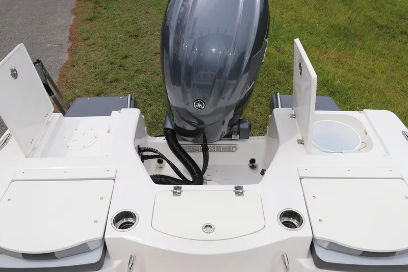 Slide: The Image of 2026 Robalo 206 Cayman boat stern with outboard motor and storage compartments. - 9