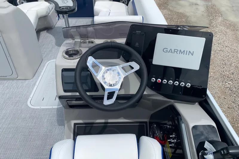 Slide: The Image of Steering console of 2026 SunCatcher Elite 326 SS with Garmin navigation system. - 12
