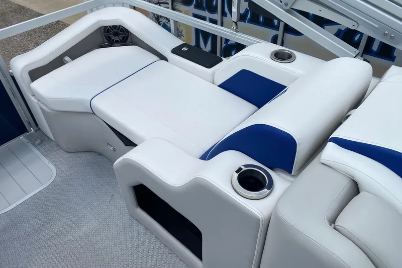 Slide: The Image of Luxurious seating on 2026 SunCatcher Elite 326 SS boat with cup holders and speaker. - 13