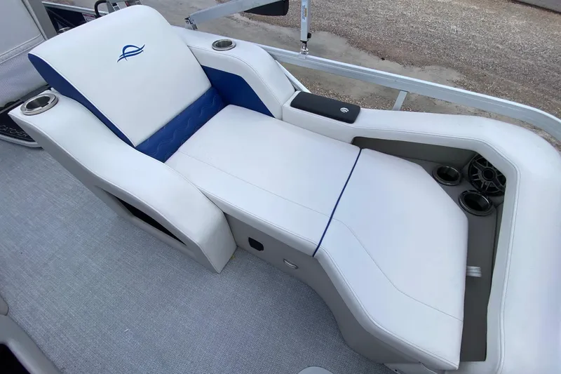 Slide: The Image of Luxurious seating on 2026 SunCatcher Elite 326 SS boat with cup holders and speaker. - 14