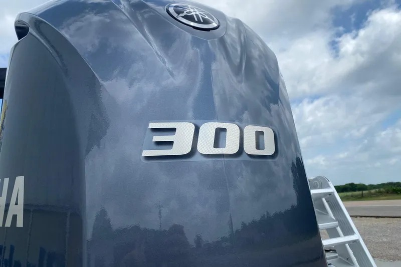 Slide: The Image of Yamaha 300 outboard motor on SunCatcher Elite 326 SS, 2026 model, under cloudy sky. - 5