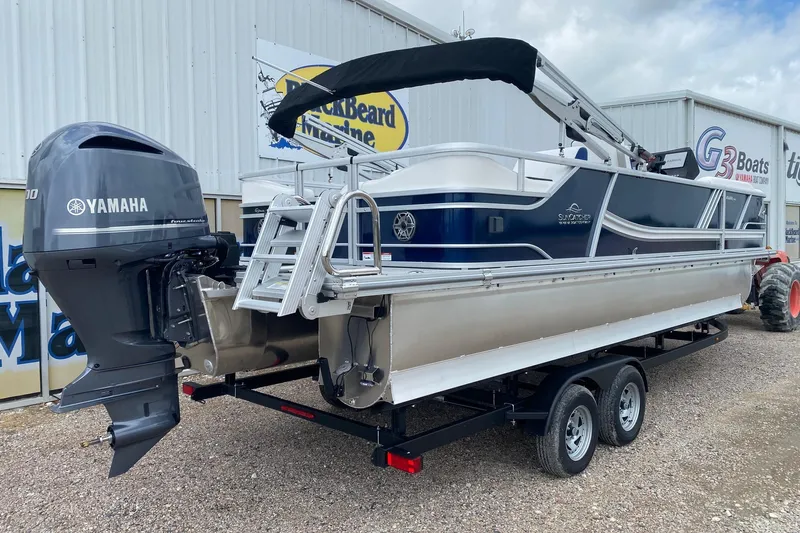 Slide: The Image of 2026 SunCatcher Elite 326 SS pontoon boat with Yamaha engine on trailer. - 6