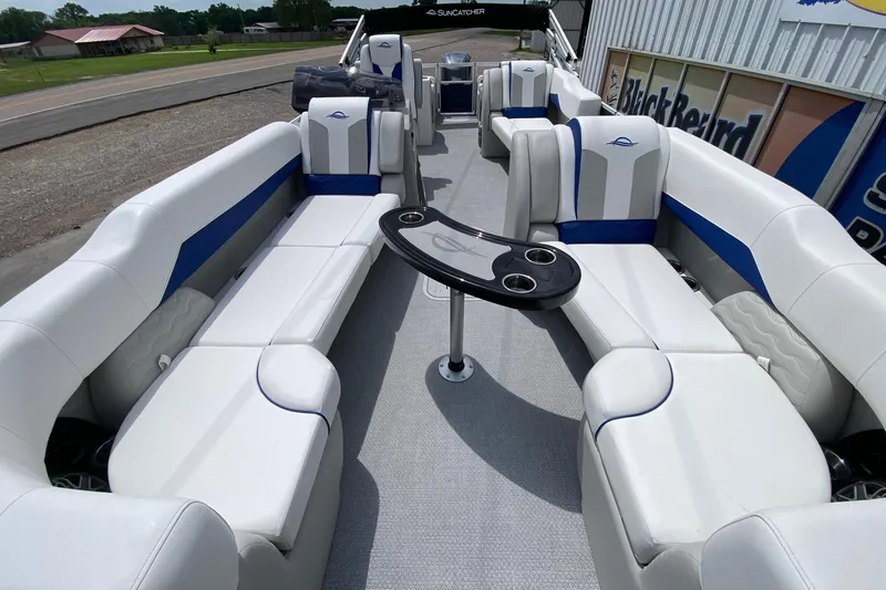Slide: The Image of 2026 SunCatcher Elite 326 SS pontoon boat with luxurious seating and modern design. - 7