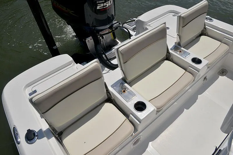 Slide: The Image of Manufacturer Provided Image: 2017 NauticStar 227 XTS boat with three cushioned seats and a 250 HP outboard motor. - 11