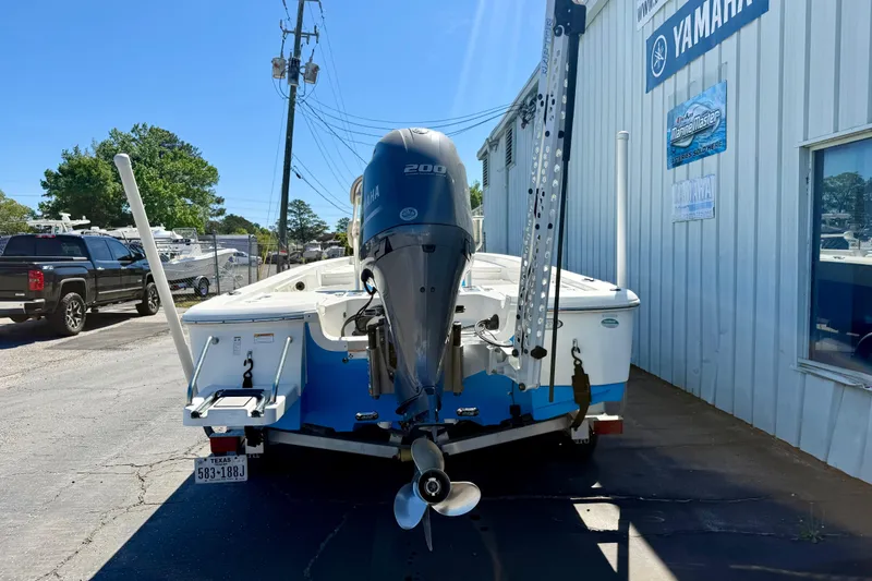 Slide: The Image of 2017 NauticStar 227 XTS boat with Yamaha engine, parked outside a Yamaha dealership. - 4