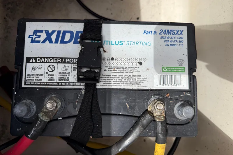 Slide: The Image of Exide Nautilus battery in a 2017 Scout 210 Dorado boat, secured with straps. - 11