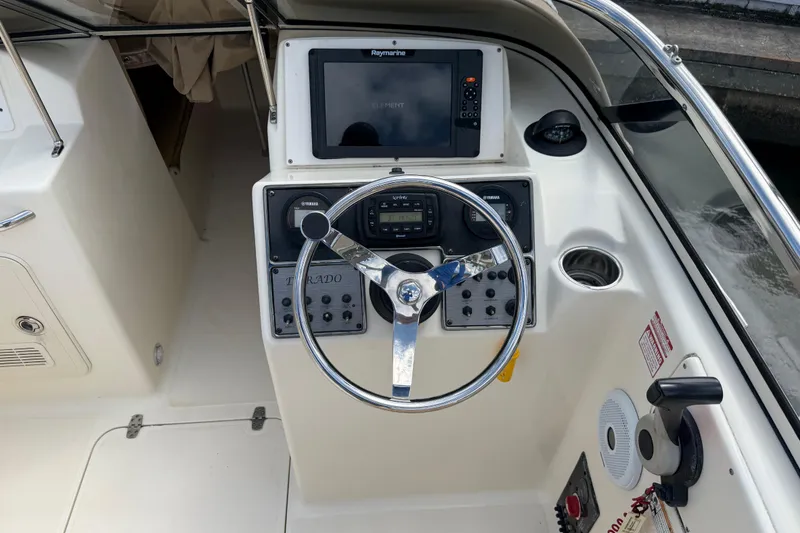 Slide: The Image of Steering console of a 2017 Scout 210 Dorado boat with navigation equipment. - 22