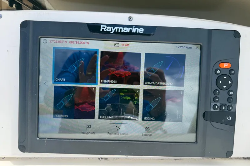 Slide: The Image of Raymarine navigation display on 2017 Scout 210 Dorado boat, showing chart and fishfinder options. - 24