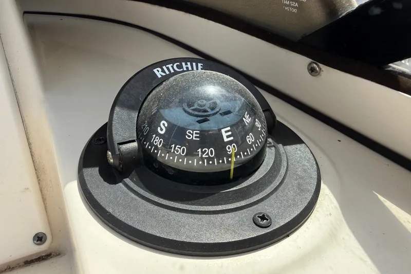 Slide: The Image of Compass on 2017 Scout 210 Dorado boat dashboard, showing east direction. - 30