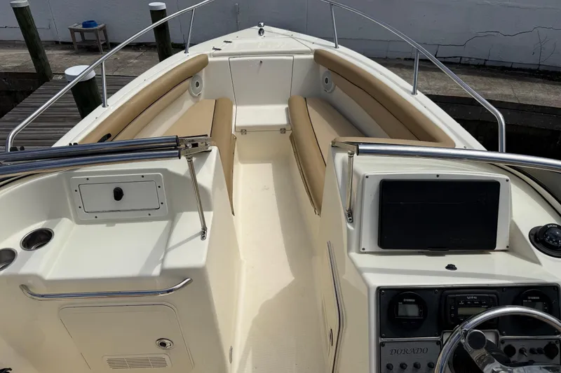 Slide: The Image of 2017 Scout 210 Dorado boat interior with beige seating and control panel. - 36