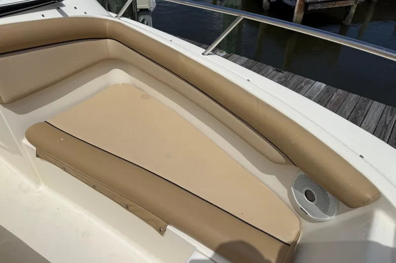 Slide: The Image of 2017 Scout 210 Dorado boat with tan seating and stainless steel railing. - 40