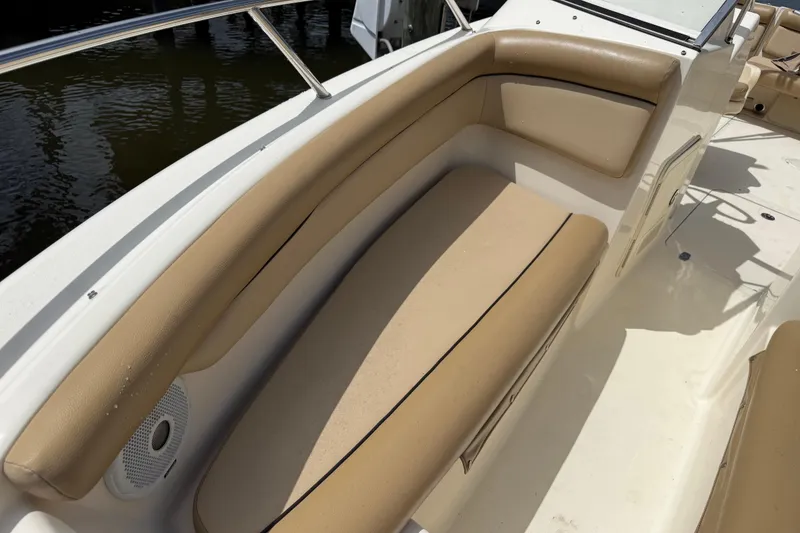 Slide: The Image of 2017 Scout 210 Dorado boat with tan seating and white deck. - 41