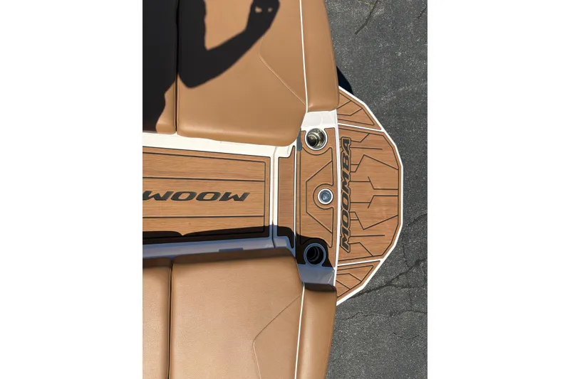 Slide: The Image of 2023 Moomba Kaiyen boat deck with tan upholstery and logo detailing. - 18