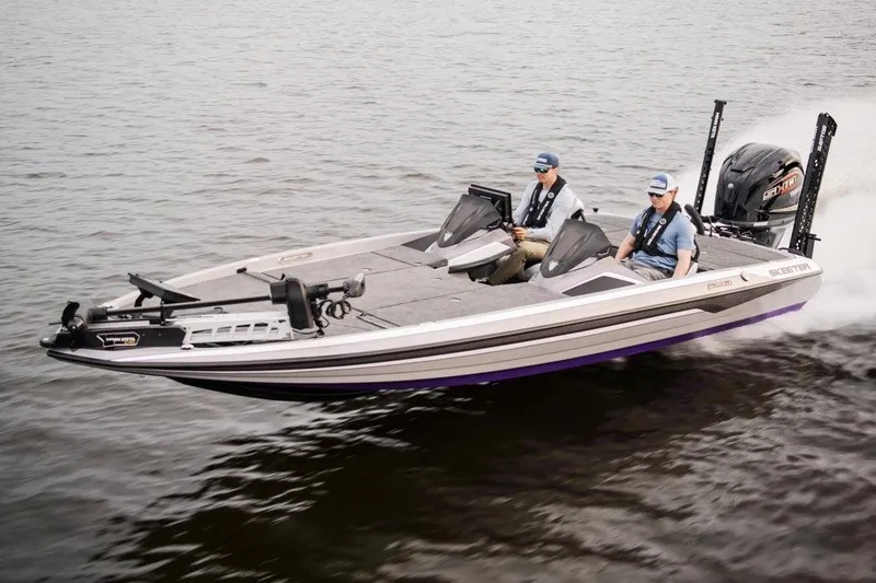 Slide: The Image of Manufacturer Provided Image: 2026 Skeeter FXR21 FLEX boat cruising on water with two passengers. - 11