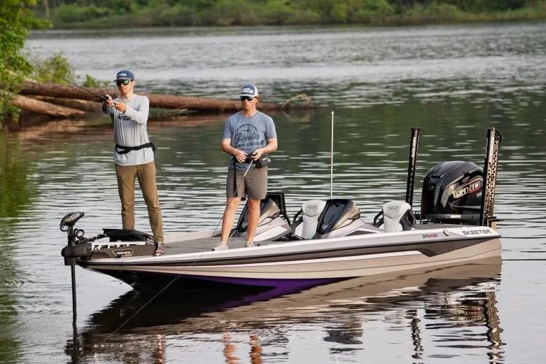 Slide: The Image of Manufacturer Provided Image: Two people fishing on a 2026 Skeeter FXR21 FLEX boat in a serene lake. - 12