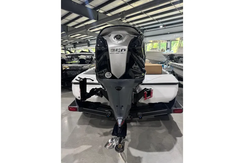 Slide: The Image of 2026 Skeeter FXR21 FLEX boat with powerful 350 horsepower engine in showroom. - 4