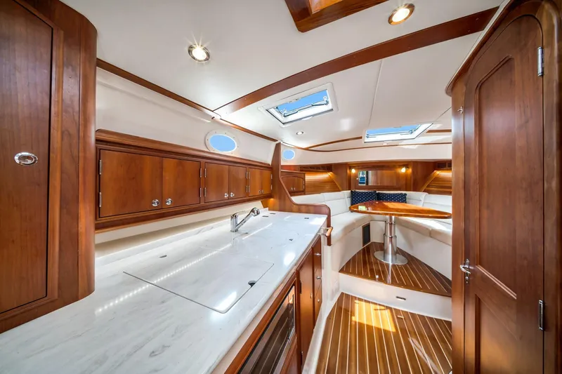 Slide: The Image of Luxurious interior of 2020 Hinckley Picnic Boat 40 with elegant wood finishes and modern amenities. - 10