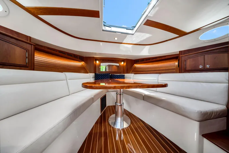 Slide: The Image of Luxurious interior of 2020 Hinckley Picnic Boat 40 with elegant seating and wooden finishes. - 11