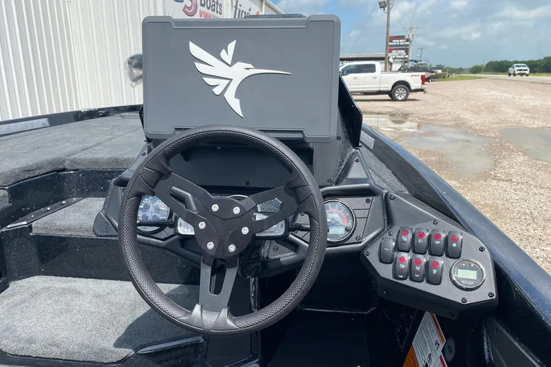 Slide: The Image of Steering console of 2026 Skeeter ZXE20 boat with modern controls and logo. - 10