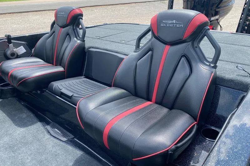 Slide: The Image of 2026 Skeeter ZXE20 boat seats with black and red design, showcasing luxury and comfort. - 12