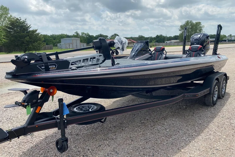 Slide: The Image of 2026 Skeeter ZXE20 boat on trailer, featuring dual seats and Minn Kota trolling motor. - 3