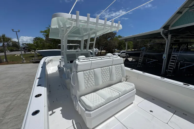 Slide: The Image of 2024 Invincible 33 Catamaran with white seating and modern helm station. - 35