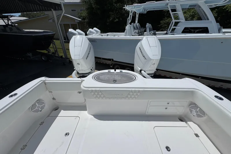 Slide: The Image of 2024 Invincible 33 Catamaran with dual Mercury outboard engines, spacious deck view. - 39