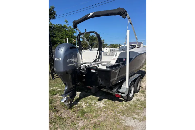 Slide: The Image of 2023 Starcraft SVX 191 OB boat with Yamaha 150 engine on trailer. - 18