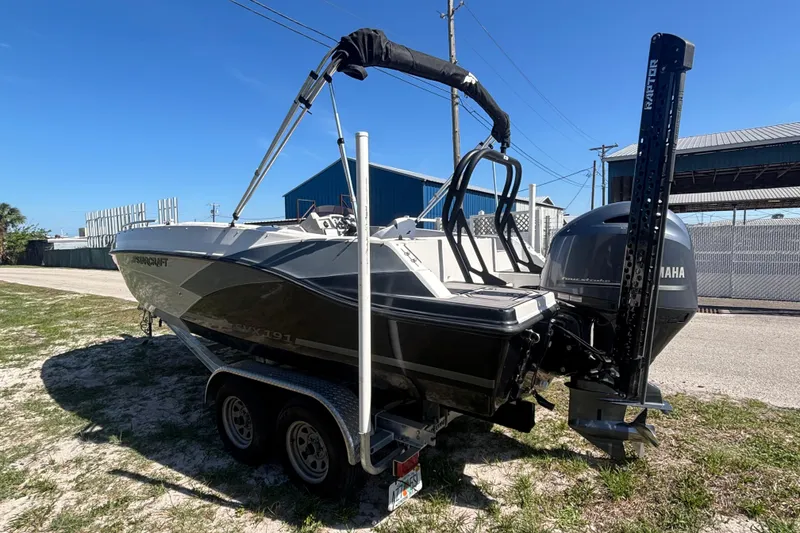Slide: The Image of 2023 Starcraft SVX 191 OB boat on trailer, featuring Yamaha outboard motor. - 22