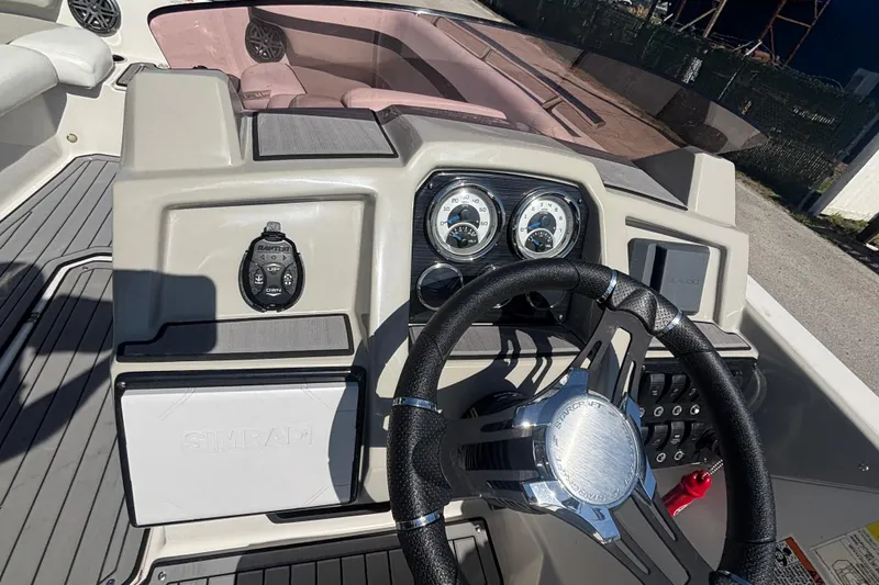 Slide: The Image of 2023 Starcraft SVX 191 OB boat dashboard with steering wheel and gauges. - 24