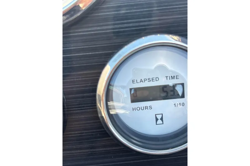 Slide: The Image of Elapsed time gauge showing 53.3 hours on 2023 Starcraft SVX 191 OB. - 25