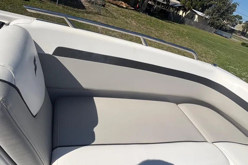 Slide: The Image of 2023 Starcraft SVX 191 OB boat interior with white cushioned seating. - 7