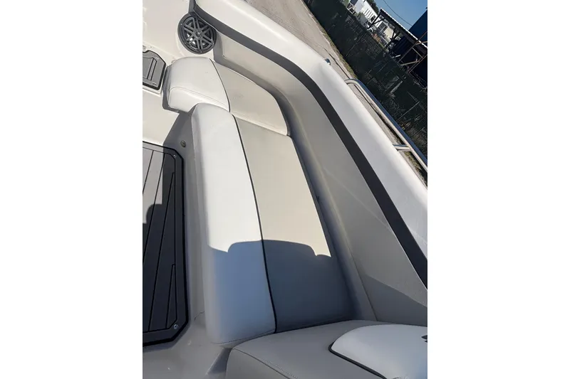 Slide: The Image of 2023 Starcraft SVX 191 OB boat interior with white seating and speaker detail. - 8