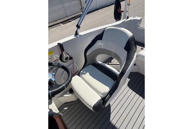 Slide: The Image of Captain's seat on 2023 Starcraft SVX 191 OB boat, featuring sleek design and comfortable upholstery. - 9