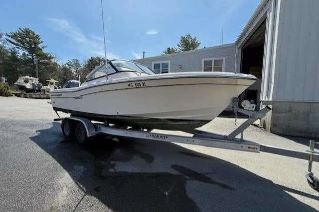 The Image of 2015 Grady-White Freedom 225 boat on trailer outside a building. - 1