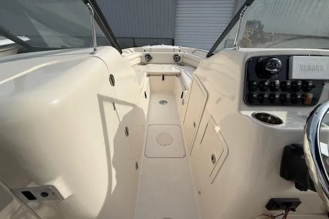 Slide: The Image of 2015 Grady-White Freedom 225 boat interior with Yamaha controls and spacious seating. - 15