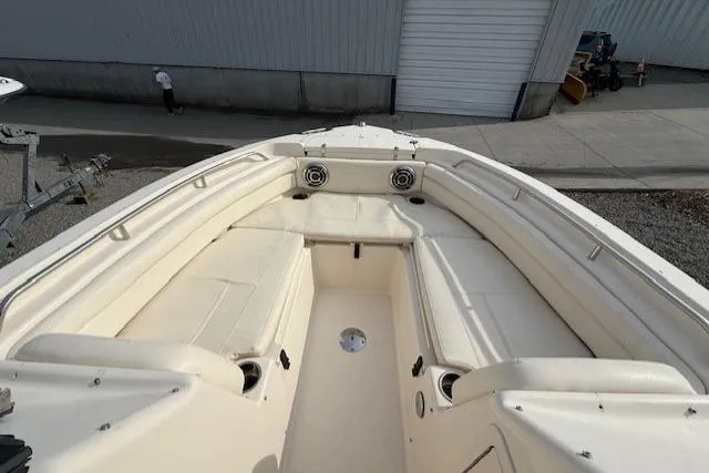 Slide: The Image of 2015 Grady-White Freedom 225 boat interior with spacious seating and cup holders. - 16