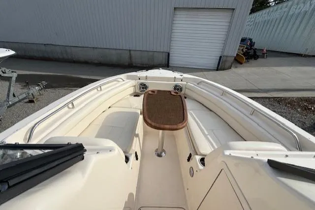 Slide: The Image of 2015 Grady-White Freedom 225 boat interior with seating and table. - 17