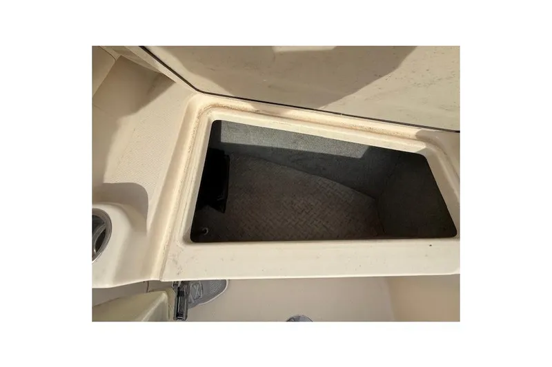 Slide: The Image of Storage compartment on a 2015 Grady-White Freedom 225 boat, open and empty. - 22