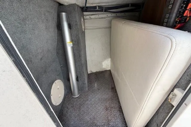 Slide: The Image of Interior cabin of 2015 Grady-White Freedom 225 boat with seating and storage. - 24