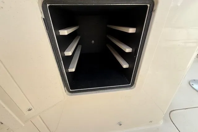 Slide: The Image of Storage compartment on a 2015 Grady-White Freedom 225 boat. - 25