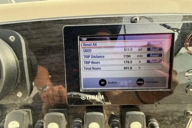 Slide: The Image of Dashboard of a 2015 Grady-White Freedom 225 showing trip data and fuel usage. - 27