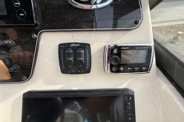 Slide: The Image of Control panel of a 2015 Grady-White Freedom 225 boat with electronic devices. - 28