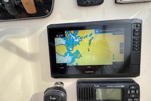 Slide: The Image of Garmin navigation system on 2015 Grady-White Freedom 225 boat dashboard. - 29