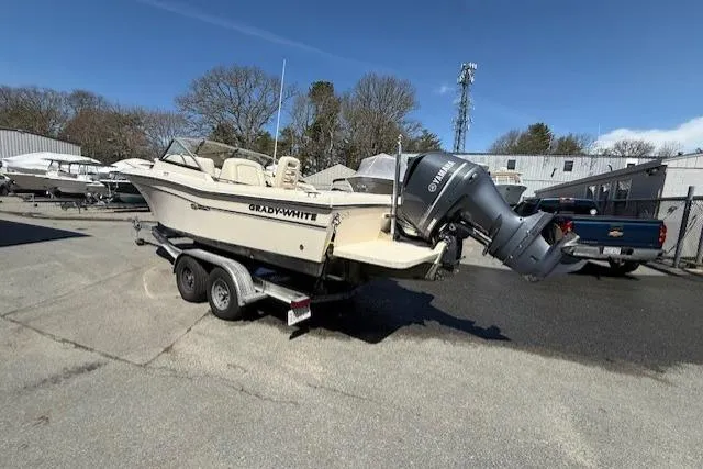 Slide: The Image of 2015 Grady-White Freedom 225 boat on trailer in outdoor lot. - 3