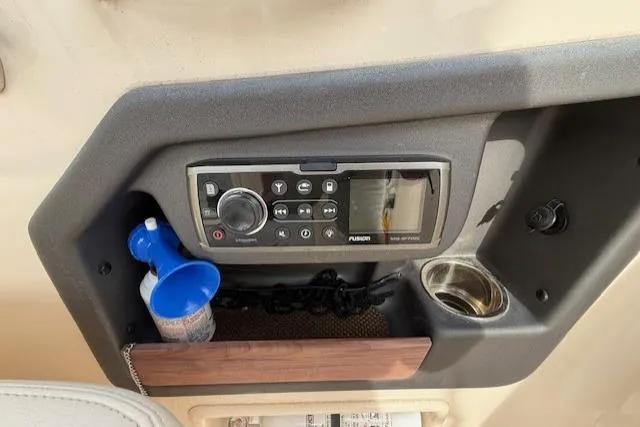 Slide: The Image of Control panel of 2015 Grady-White Freedom 225 boat with stereo system and accessories. - 31