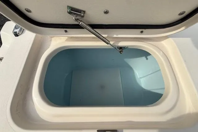 Slide: The Image of Open storage compartment on 2015 Grady-White Freedom 225 boat. - 33
