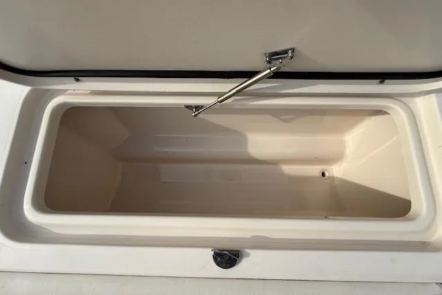 Slide: The Image of Open storage compartment on a 2015 Grady-White Freedom 225 boat. - 34